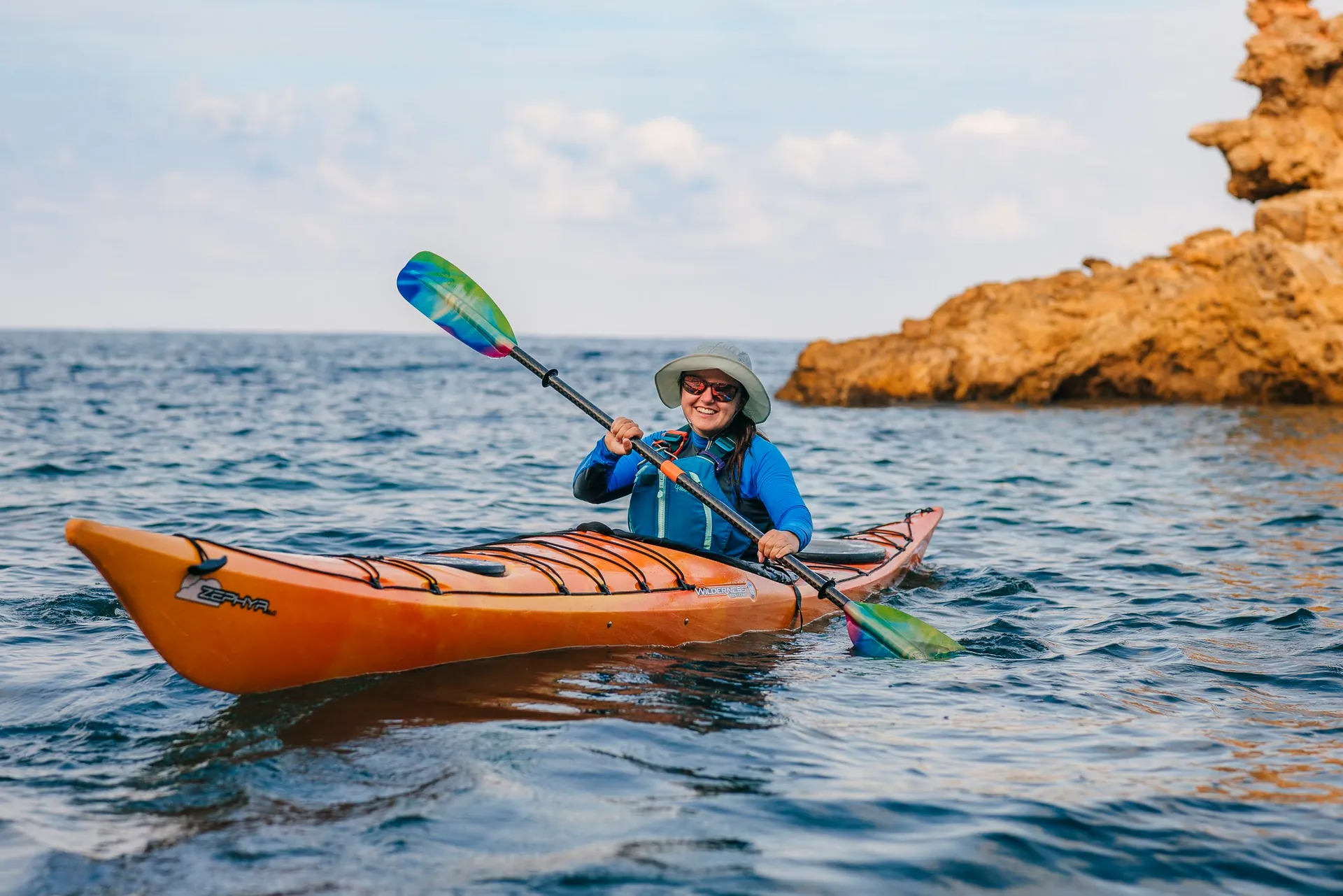 Paddling a sea kayak at golden hour in Ibiza