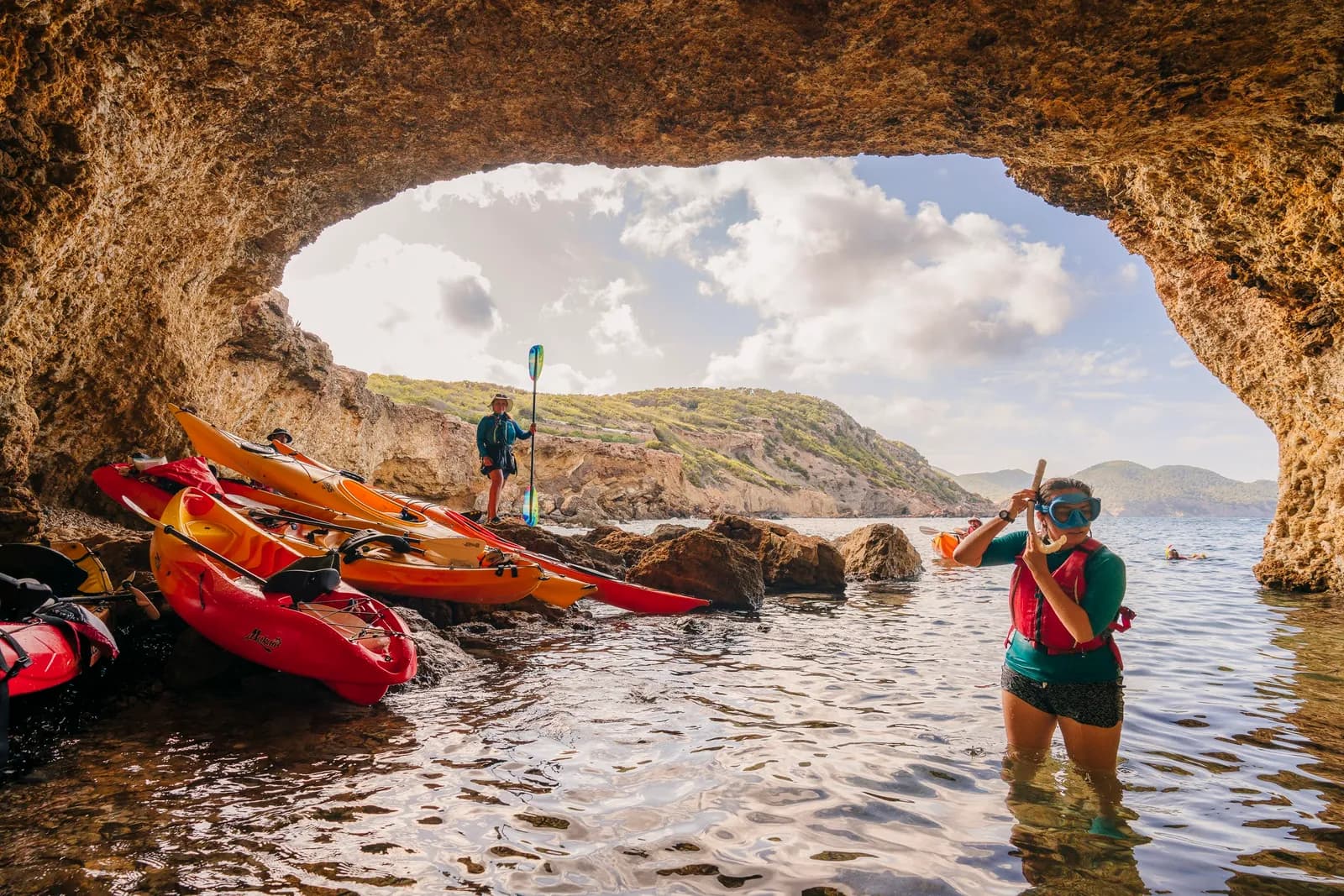 Kayak entering a sea cave on a snorkel tour